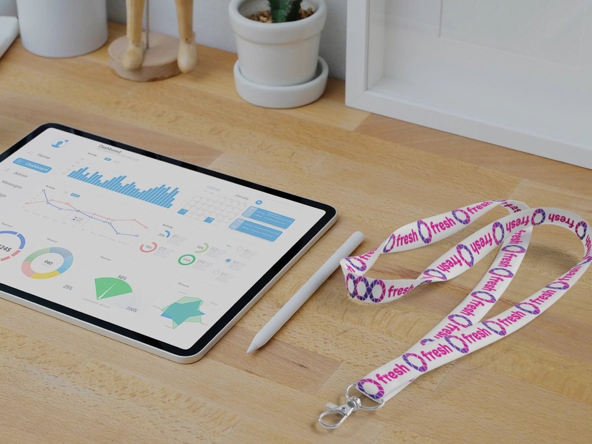 Branded lanyards and a tablet on an event registration desk